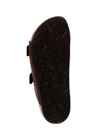 Braune Schuhsohle mit einer strukturierten, gemusterten Unterseite, die ovale Formen und erhabene Akzente aufweist, die Abnutzungs- und Grifffdetails zeigen.