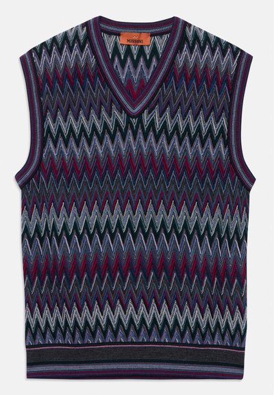 Bez piedurknēm adītā veste ar V veida kakla izgriezumu, kurai ir daudzkrāsains zigzaga raksts violetos, zilos, bordo un melnos toņos, apzīmēta ar Missoni.