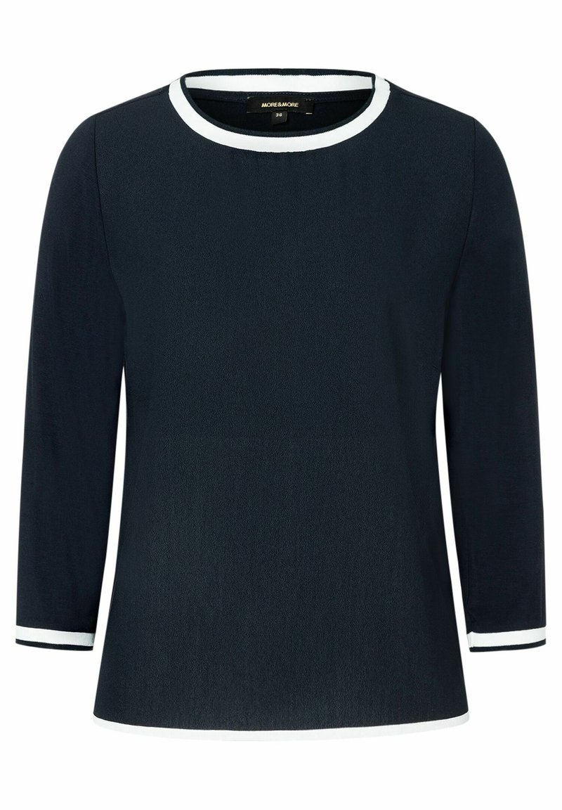 Mörkblå långärmad topp med rund halsringning i vitt och vita manschetter. Tillverkad av ett mjukt tyg med en avslappnad passform.