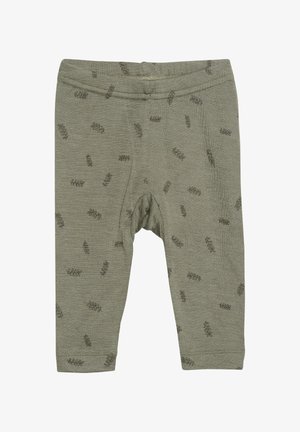 Olivengroene leggings van zacht materiaal met een subtiel bladerenpatroon in een donkerder groen. Elastische tailleband en nauwsluitende pasvorm.