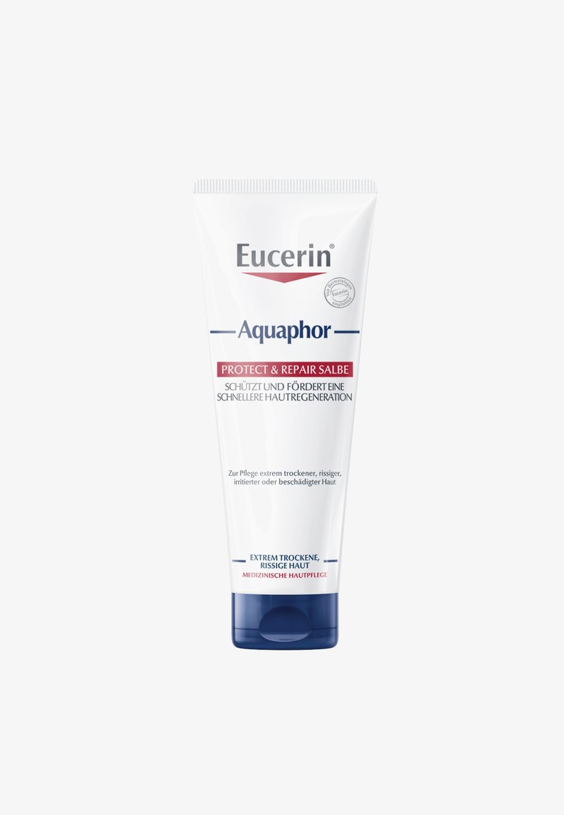 Eucerin Aquaphor tube, white with blue accents, featuring "Protect & Repair" in red text. Designed for dry, irritated skin. 100 mL.