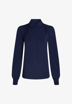 Marineblaues Langarmhemd mit Kragen, Knopfleiste, Fältchendetails an den Schultern und elastischen Bündchen. Glatte Stofftextur.
