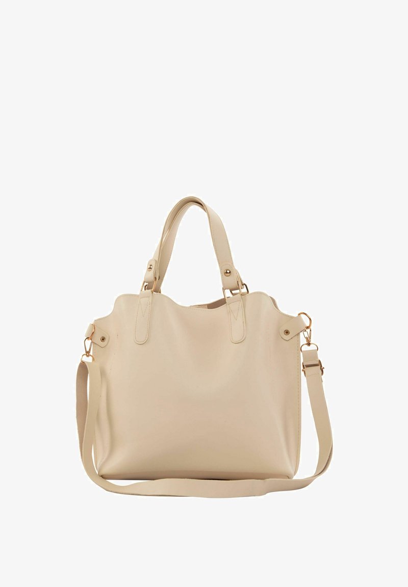 Bežīga ādas plecu soma ar divām rokām, noņemamu plecu jostu un zeltainas krāsas aparatūru. Gluda tekstūra ar noapaļotiem stūriem un minimālu apdari.