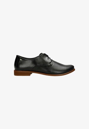 Black leather men's dress shoe with perforated toe, lace-up design, and brown sole, shown in side profile against white background.