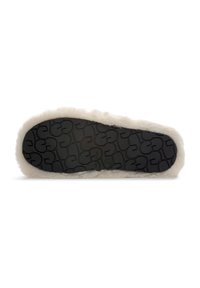 Fuzzy cream slipper with a black textured rubber sole. Wrapped plush material along the sides, providing a cozy appearance.