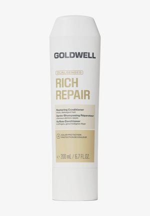 Goldwell Dualsenses Rich Repair herstellende conditioner voor dik, beschadigd haar met kleurbehoud, 200 ml witte fles met gouden en zwarte tekst.