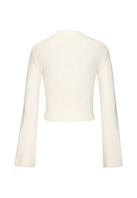 Trumpas megztinis šviesiai kreminės spalvos, su ilgomis varpo formos rankovėmis ir šonkauliuota tekstūra, paprastu apvaliu iškirpimu.