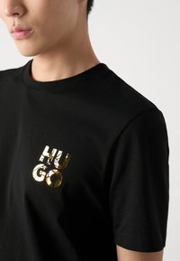 HUGO DIRIDUMTI - T-shirt - bas - black