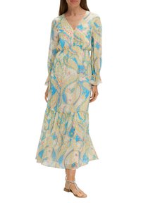 Langes, fließendes Kleid in einem Paisleymuster mit blauen, gelben und rosa Farbtönen. Hergestellt aus leichtem Stoff mit V-Ausschnitt und Puffärmeln.