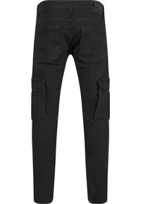 Pantalon cargo noir slim fit avec poches arrière, poches à rabat latérales sur les deux jambes et passants de ceinture, présenté de dos sur fond blanc.