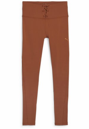 Brune leggings laget av stretchy materiale, med høy midje og snøring, glatt tekstur og en liten logo på siden.