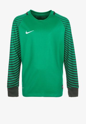 Zielona, długorękawowa koszulka sportowa z czarno-zielonymi paskami na rękawach. Ma okrągły dekolt i białe logo Nike na klatce piersiowej.