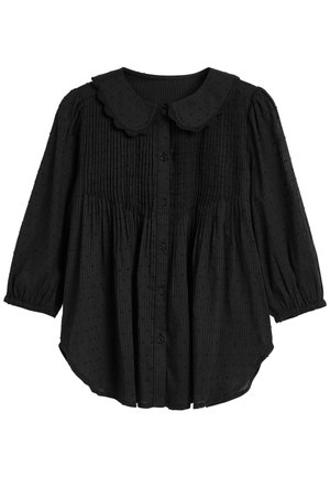 Czarna bluzka z długim rękawem, z plisowanym przodem, teksturowanym wzorem w kropki, zaokrąglonym kołnierzykiem typu Peter Pan i zapięciem na guziki.