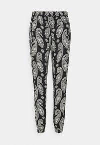 Zwarte broek met een paisleypatroon in het wit en bloemaccenten. Elastische tailleband en taps toelopende benen van een lichtgewicht stof.