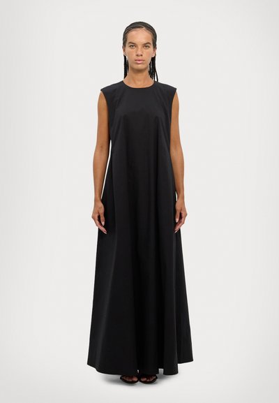 Black sleeveless maxi dress with a round neckline and a loose fit, made of smooth fabric, falling to the ankles, minimalistic design.