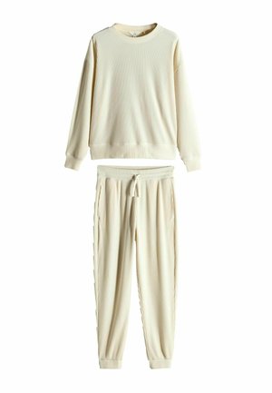 Krämlik ribbad sweatshirt med rund halsringning och långa ärmar, i kombination med matchande ribbade tapered sweatpants med justerbar dragsko.