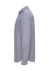 Langarm-Hemd aus hellblauem Chambray-Stoff, mit Kragen, Knöpfen vorne und einem einzelnen Knopf an den Manschetten.