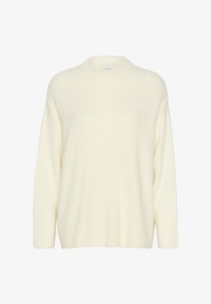 Kremni pulover iz mehke, puhaste tkanine. Ima okroglo ovratnik, dolge rokave ter rebraste manšete in rob za dodatno teksturo.