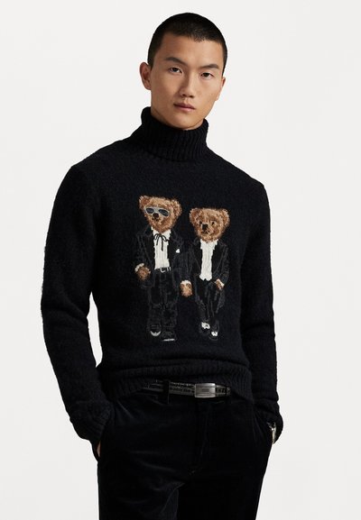 Black knitted turtleneck sweater featuring an embroidered design of two bears in tuxedos and sunglasses, detailed with a textured finish.