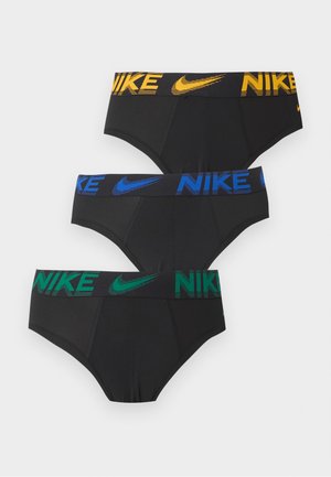Tre sorte Nike briefs stablet vertikalt, hver med en farvet linning i gul, blå og grøn med Nike-logoet og swoosh.
