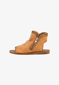 Sélectionné, couro