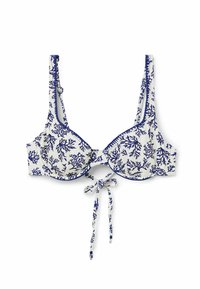 Top de bikini blanco con patrón de coral azul, cierre de lazo en el centro y tirantes anchos. Ribeteado en azul a lo largo de los bordes y copas para un contraste.