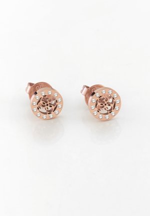 Roségold Ohrstecker mit rundem Design, mit zwölf kleinen klaren Kristallen um ein ausgeschnittenes Blumendesign in der Mitte.
