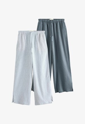 Two pairs of wide-leg pants with drawstring waistbands, one light gray and one dark gray, featuring a textured fabric and small side slits.