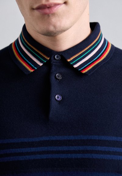 Navy polo shirt with a multicolored striped collar, three buttons, and horizontal blue stripes across the chest. Soft texture.