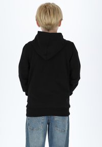 Black hoodie with a smooth texture, featuring a large hood and a relaxed fit. Paired with light blue denim jeans.