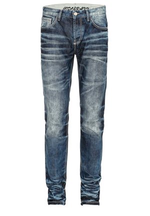 Slim-fit jeans in donkerblauwe denim met vervaagde accenten. Voorzien van vijf zakken, contrasterende stiksels en een knoopsluiting.