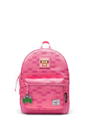 Zaino rosa acceso pixelato con una toppa a forma di faccia di maiale di Minecraft, tasca anteriore con zip e tiralampo a forma di tulipano, fotografato su sfondo bianco.