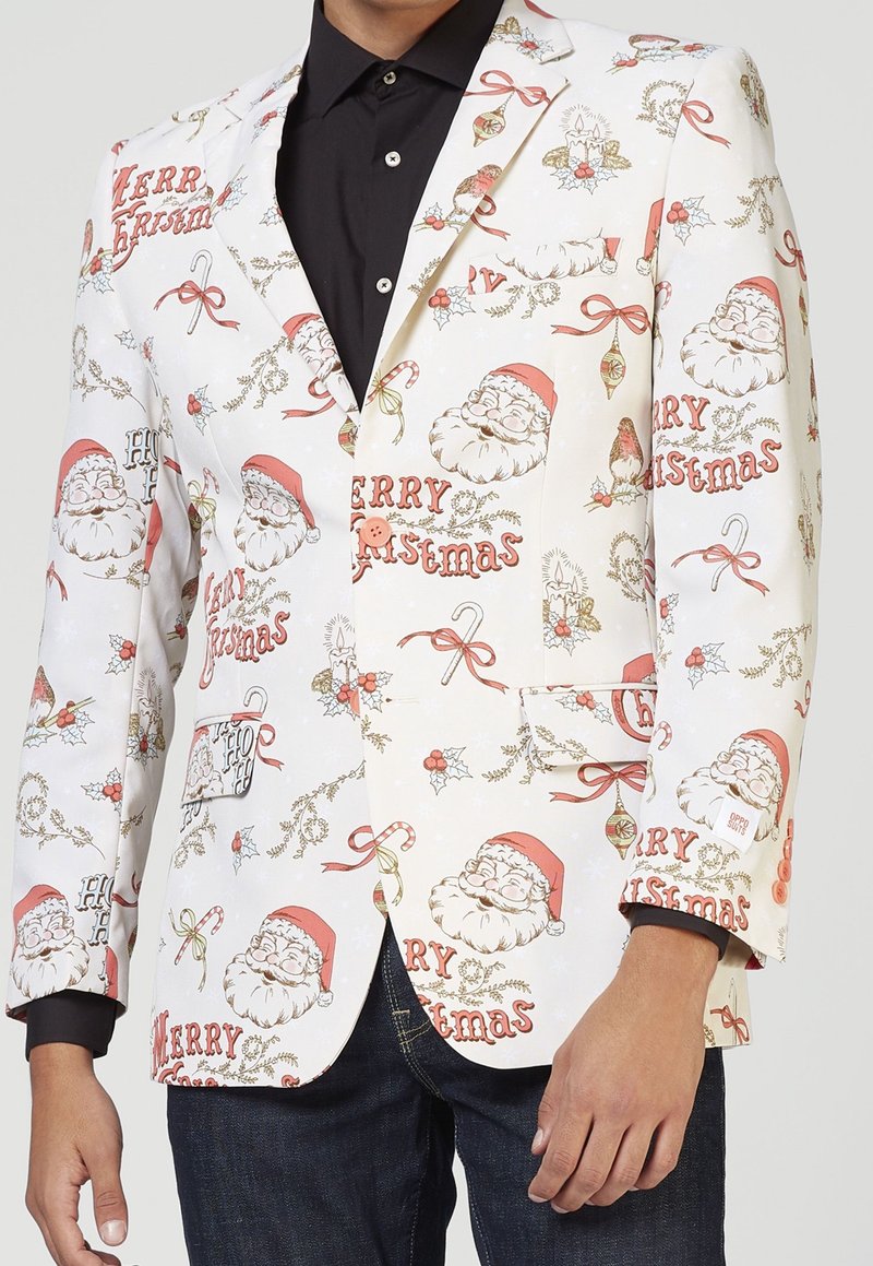 Witte blazer met feestelijke kerstmannen, kerstversieringen en hulst, met rode, groene en gouden accenten. Één zak op de borst.