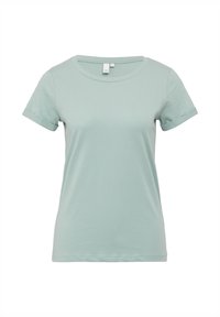 T-shirt en coton bleu clair à manches courtes avec un col rond et des manches retroussées. Texture lisse et coupe régulière, avec un design simple.