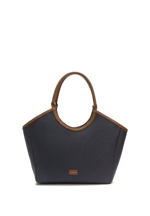 Tote bag tummansininen, jossa on sileät ruskeat nahkakoristeet, pyöreät kahvat ja jämäkkä muoto. Teksturoitu kangasrunko, jossa on logotunnus.