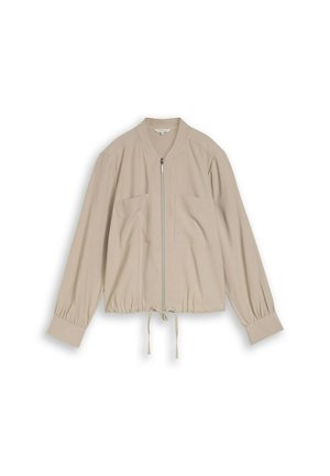Beige leichte Jacke mit Frontreißverschluss, zwei Brusttaschen, Kordelzug am Saum, langen gesammelten Ärmeln und breiten Manschetten.