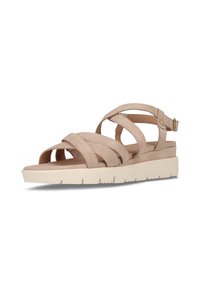 Beige Wildledersandalen mit mehreren kreuz und quer verlaufenden Riemen, verstellbarem Knöchelriemen und einer hellen Plattformsohle mit strukturiertem Untergrund.