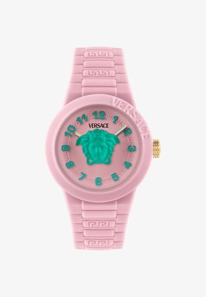 Ružové hodinky Versace s tyrkysovými číslicami a hlavou Medusy na ciferníku, reliéfny remienok s gréckym kľúčovým vzorom a zlatá korunka na boku.