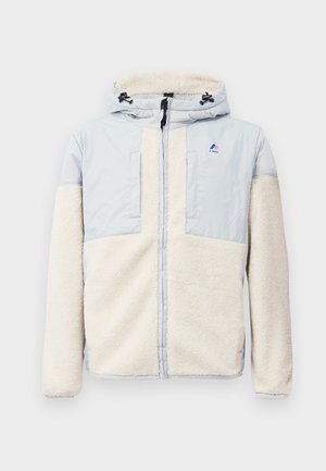 Fleece jacket with a hood, featuring light gray nylon shoulders and cream-colored body. Includes a front zipper and chest pockets.