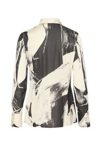 Long-sleeve blouse with a black and white abstract paint pattern, made of smooth fabric. Features a classic collar and buttoned cuffs.