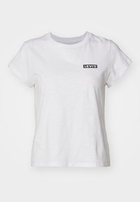 Bílé tričko s krátkým rukávem vyrobené z bavlny, s černým logem Levi's na levé části hrudi. Jednoduchý design s kulatým výstřihem.