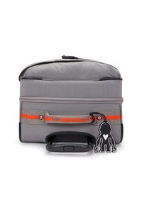 Gray wheeled bag featuring a padded top, orange stripe accents, a black handle, and a charm with a silhouette design. Smooth texture.