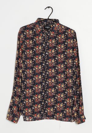 Camicia a pulsante blu navy con motivo floreale in rosso, arancio e giallo. Maniche lunghe con polsini, realizzata in tessuto morbido.