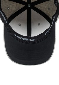 Black baseball cap with a gray underbrim, inner fabric lined in white, and a structured, flat peak. Features 'Flexfit' logo on the band.