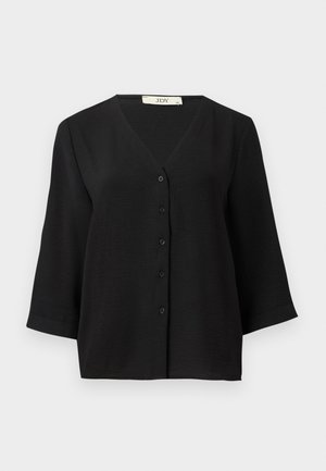 Black short-sleeve button-up top with a V-neckline, features a textured fabric and six black buttons down the front.