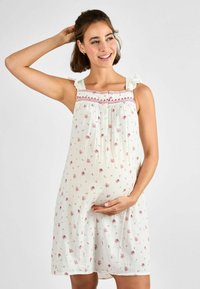 Abito materno bianco con stampa floreale rosa, spalline arricciate e piccoli bottoni lungo il colletto. Tessuto morbido e leggero.