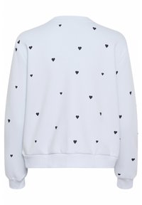 Felpa bianca con motivi a cuore neri, dotata di scollatura rotonda, maniche lunghe e polsini e orlo a coste per una vestibilità aderente.