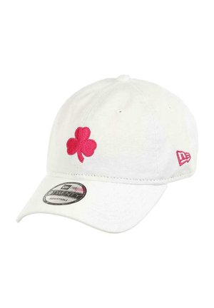 White cotton baseball cap featuring a pink embroidered shamrock on the front and a small pink logo on the side. Adjustable strap.