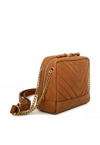 Tan leather handbag with a chevron quilted pattern, gold-tone chain strap, and top zip closure. Flat base for stability.