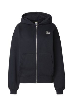 Sweat à capuche zippé bleu marine en tissu doux, avec une poche frontale, des poignets côtelés et un logo brodé sur la poitrine gauche.